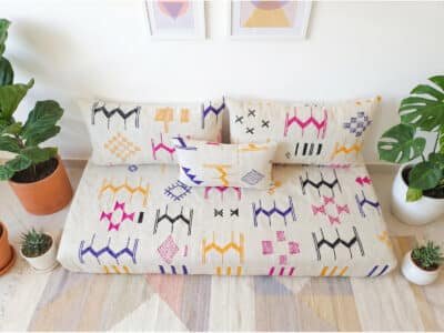 Ecru flatweave sofa set with two back pillows and one lumbar accent – fuchsia yellow indigo black Berber motifs