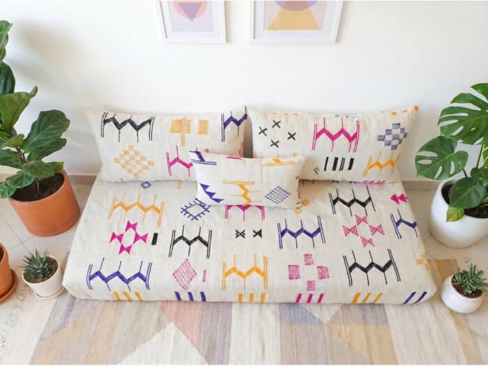 Ecru flatweave sofa set with two back pillows and one lumbar accent – fuchsia yellow indigo black Berber motifs