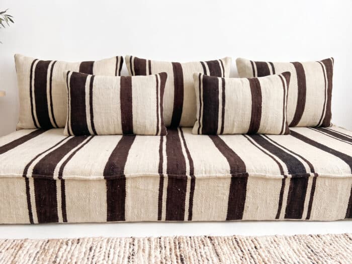 Brown striped kilim floor sofa close-up showing cream and espresso handwoven wool stripes