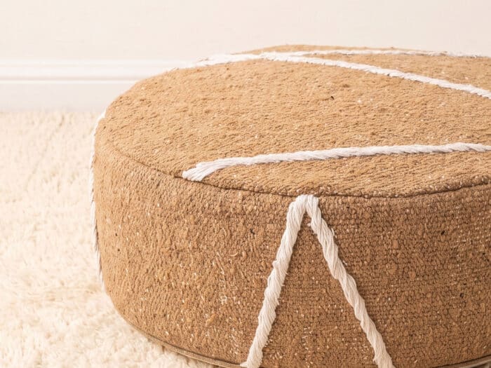 Morocco Beige Ottoman close-up showing warm camel cotton weave with white Berber cord detailing