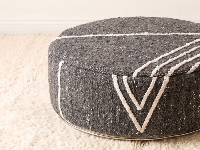 Morocco Dark Grey Ottoman close-up showing flecked grey flatweave and white Berber cord chevrons