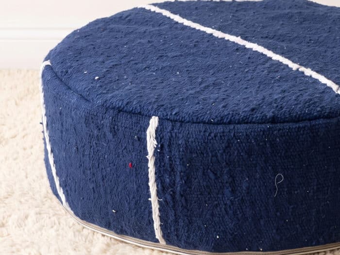 Morocco Navy Ottoman close-up showing plush deep blue cotton weave with white Berber cord lines