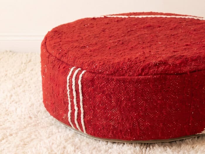 Morocco Red Ottoman close-up showing plush deep red cotton pile with white Berber cord stripes