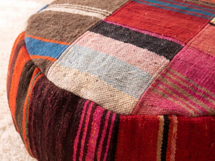 Close-up of Striped Patchwork Pouf showing powder blue, blush and cream kilim panels stitched together