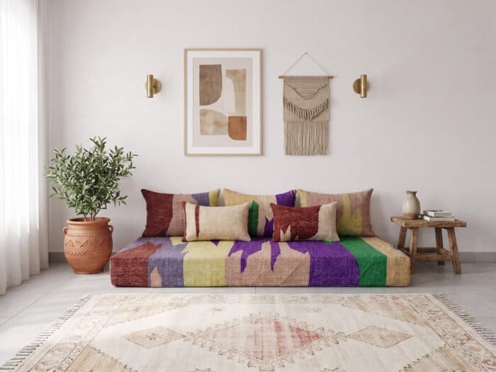 Modern abstract Moroccan daybed from above showing purple, green and rust shapes