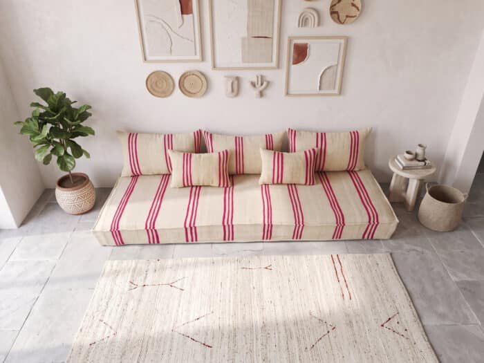 Triple stripe Moroccan floor couch seen from above, with three back pillows, two lumbar pillows and a basket