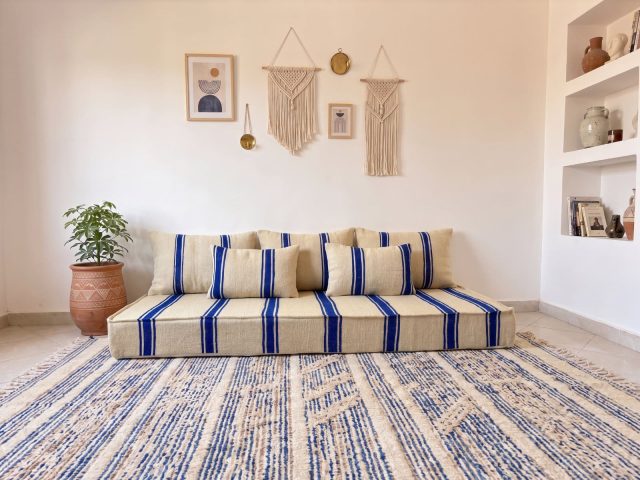 Royal blue striped floor couch cushions in ivory wool showing bold cobalt stripe flatweave detail